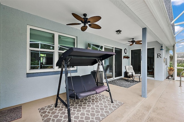 exercise room with ceiling fan