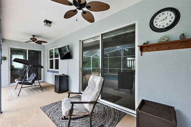 view of patio featuring ceiling fan