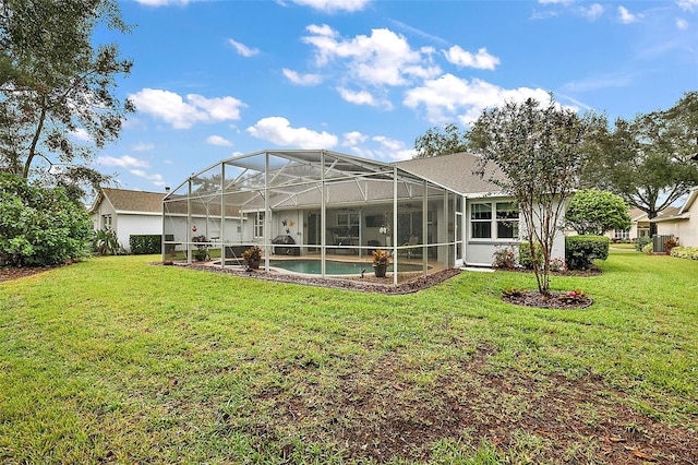 back of property featuring a lawn and a lanai