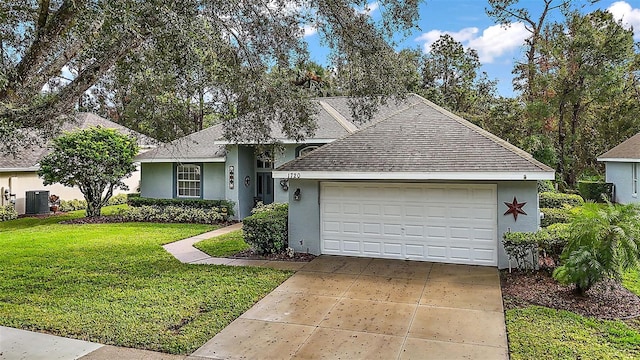 single story home featuring a front lawn, a garage, and central AC