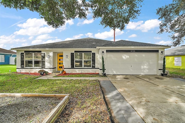 ranch-style house featuring a garage and a front yard