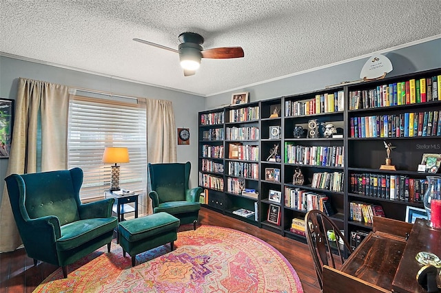 sitting room featuring ornamental molding, ceiling fan, a textured ceiling, and dark hardwood / wood-style floors