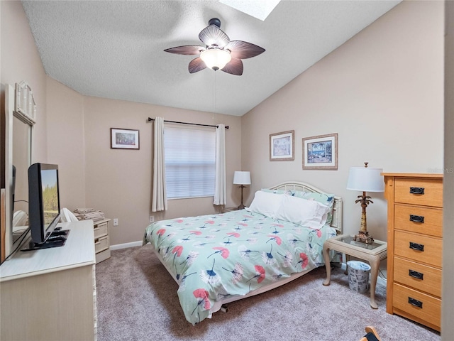 carpeted bedroom featuring lofted ceiling, a textured ceiling, and ceiling fan