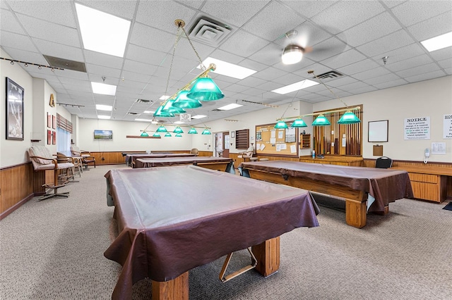 recreation room with wood walls, a paneled ceiling, and billiards