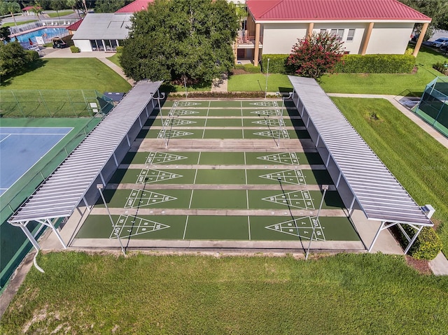 view of property's community featuring a yard