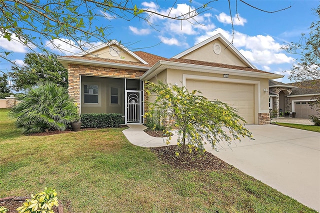 single story home featuring a front lawn and a garage