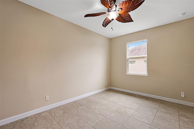 tiled empty room with ceiling fan