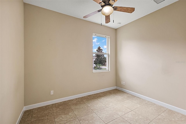 tiled empty room with ceiling fan