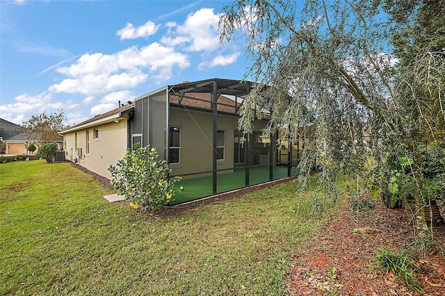 exterior space with a yard and a lanai