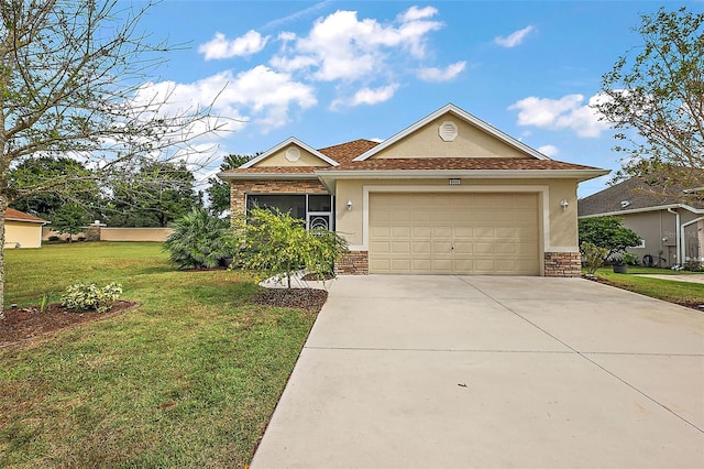 view of front facade with a garage and a front yard