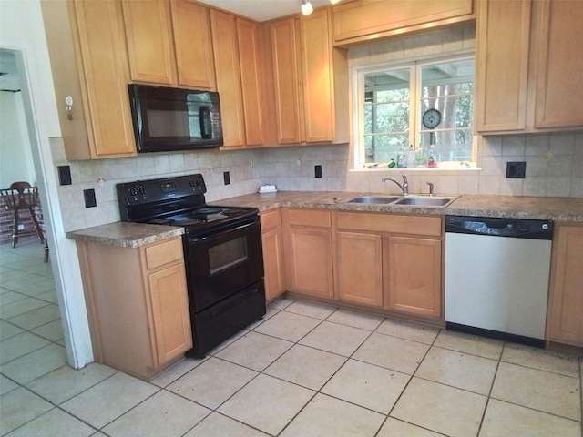 kitchen with sink, black appliances, and tasteful backsplash