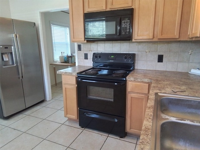 kitchen featuring black appliances, backsplash, light tile patterned floors, light brown cabinetry, and sink