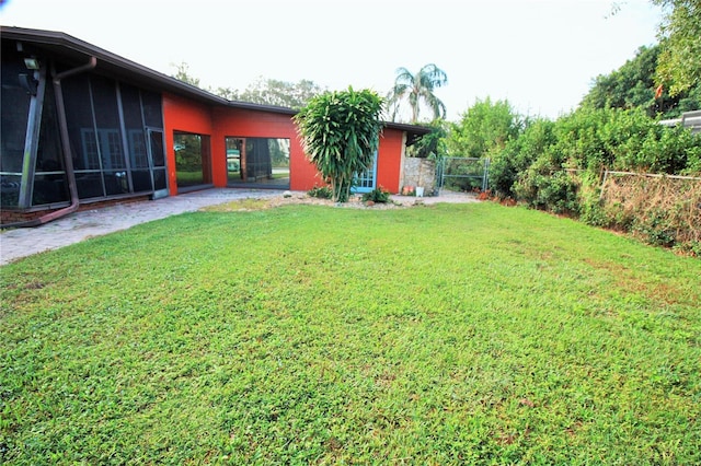 view of yard with a sunroom