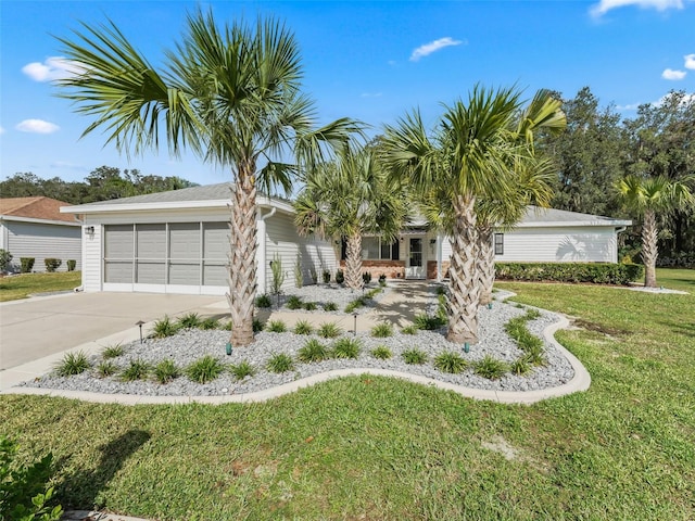 view of front of property with a garage and a front yard