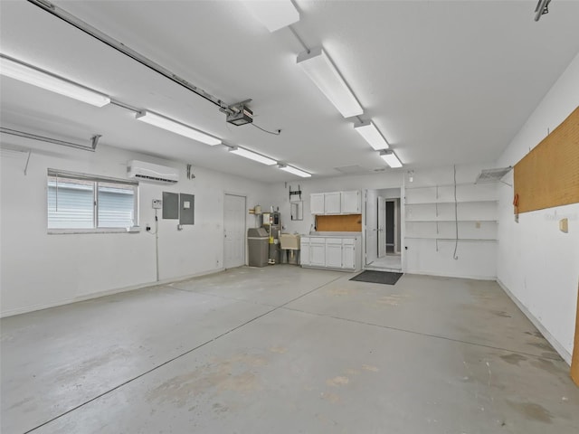 garage featuring electric panel, a garage door opener, and an AC wall unit