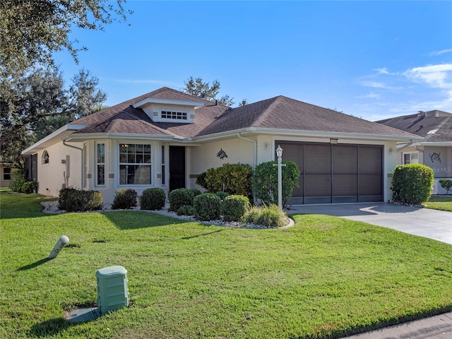 single story home with a garage and a front yard