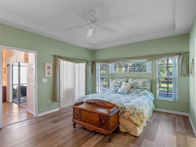 bedroom with light wood-type flooring and ceiling fan