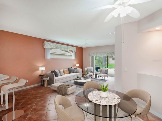 tiled living room with ceiling fan