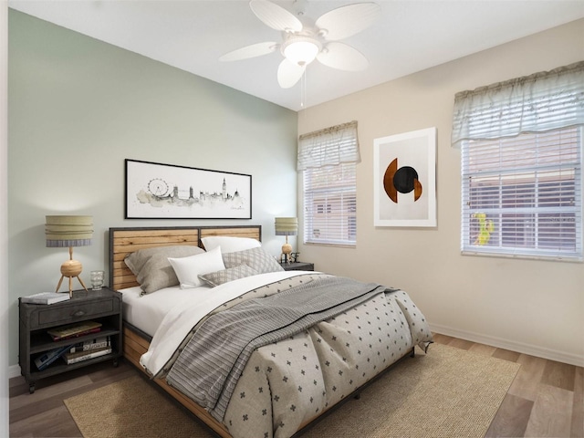 bedroom with hardwood / wood-style flooring and ceiling fan