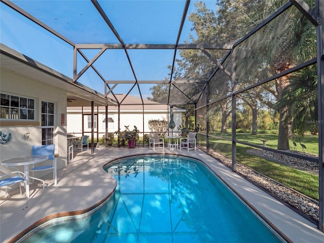 view of pool featuring a lanai and a patio