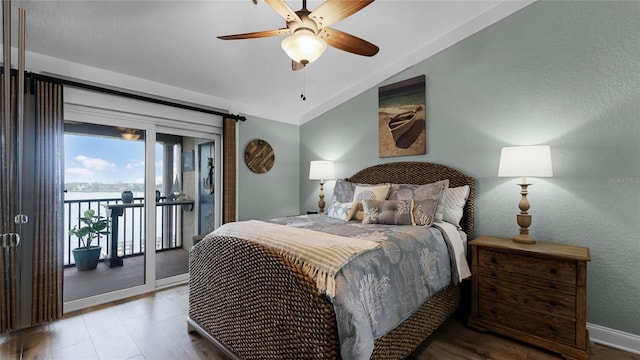 bedroom with ceiling fan, access to exterior, light wood-type flooring, and lofted ceiling