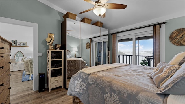 bedroom featuring access to outside, light hardwood / wood-style floors, and ceiling fan