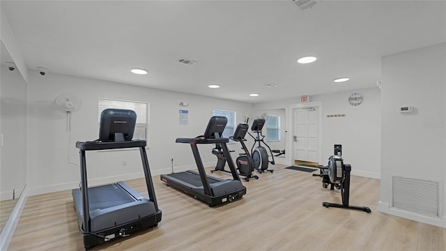 workout area featuring light hardwood / wood-style flooring