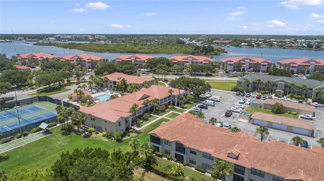 birds eye view of property with a water view