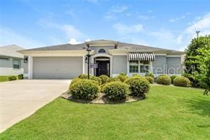 view of front facade with a front lawn and a garage