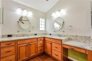 bathroom with vanity, wood-type flooring, and lofted ceiling