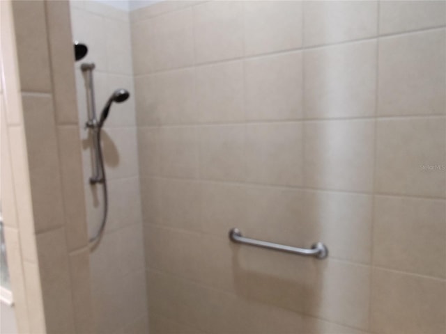 bathroom with tiled shower