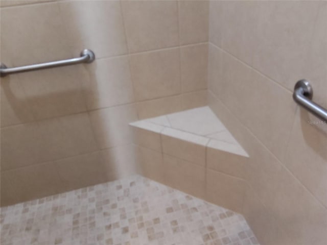 room details with a tile shower