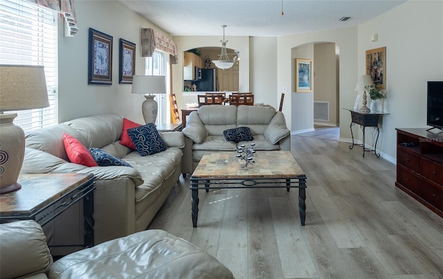 living room with light hardwood / wood-style flooring