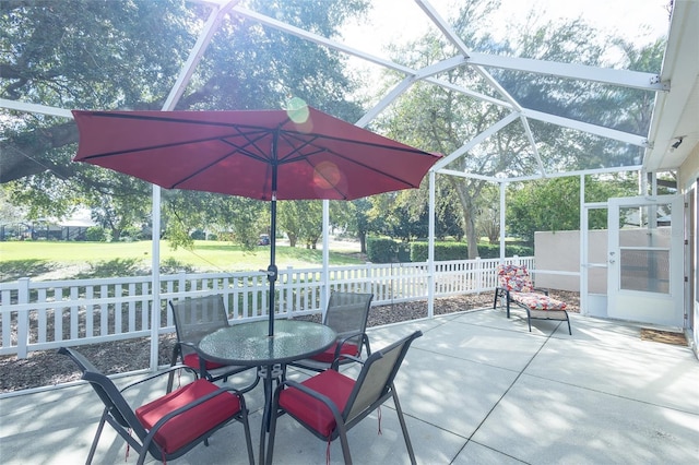 view of patio / terrace with a lanai