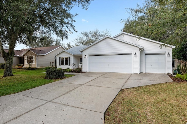 ranch-style house featuring a garage and a front yard