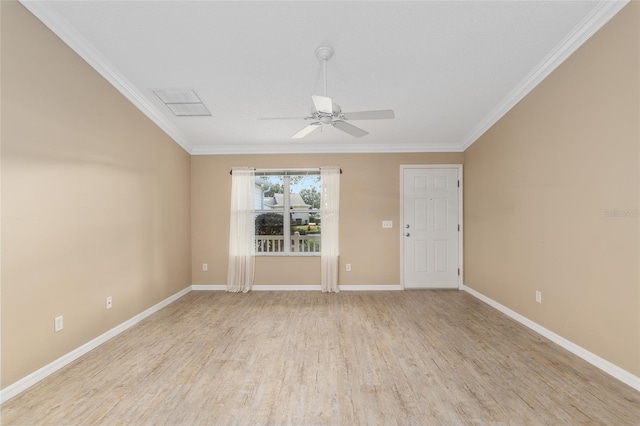 empty room with ornamental molding, light wood-type flooring, and ceiling fan