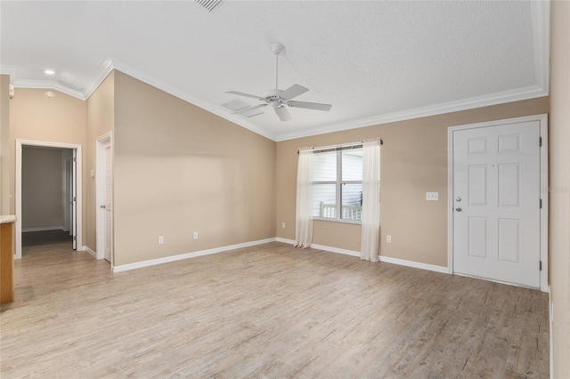 unfurnished room featuring crown molding, light wood-type flooring, a textured ceiling, vaulted ceiling, and ceiling fan