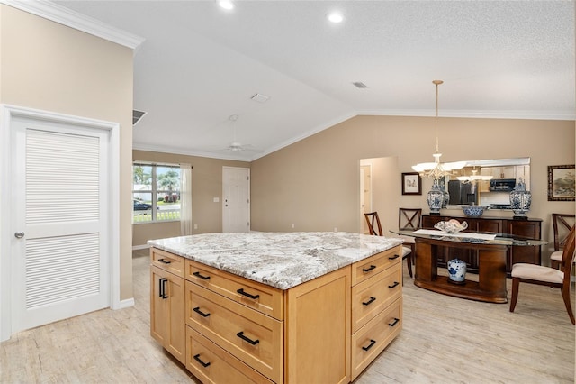 kitchen with ceiling fan with notable chandelier, light hardwood / wood-style flooring, crown molding, and vaulted ceiling