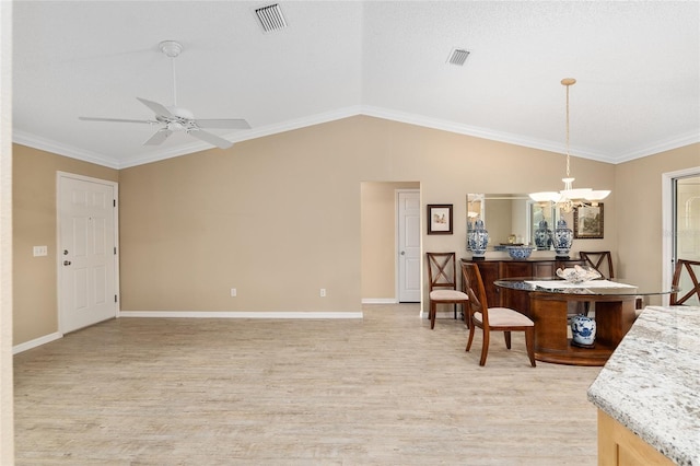 interior space with lofted ceiling, ceiling fan with notable chandelier, ornamental molding, and light hardwood / wood-style flooring