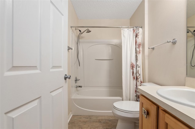 full bathroom featuring wood-type flooring, vanity, a textured ceiling, toilet, and shower / tub combo with curtain