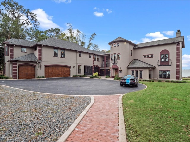 exterior space featuring a garage and a front lawn