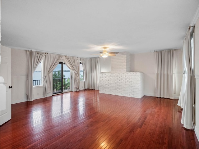 spare room with ceiling fan and dark wood-type flooring