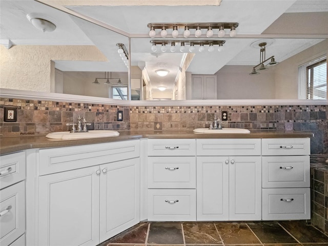 bathroom featuring backsplash and vanity