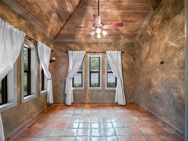 additional living space with ceiling fan, a healthy amount of sunlight, and wooden ceiling