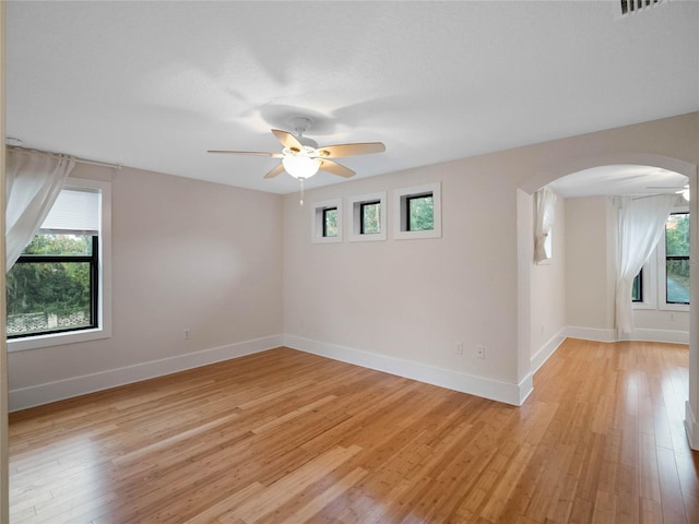 empty room featuring light hardwood / wood-style flooring and ceiling fan