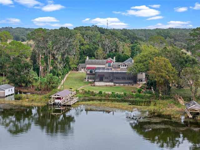 birds eye view of property with a water view