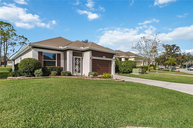 prairie-style house with a garage and a front lawn