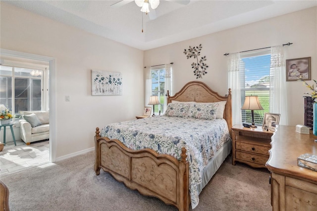 carpeted bedroom with ceiling fan