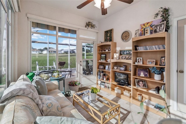 sitting room with ceiling fan and a healthy amount of sunlight