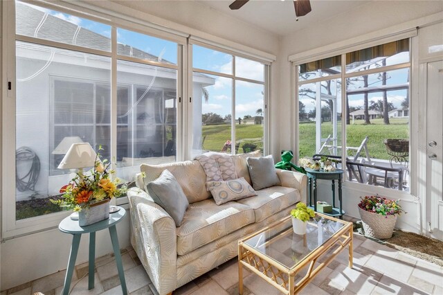 sunroom / solarium featuring ceiling fan